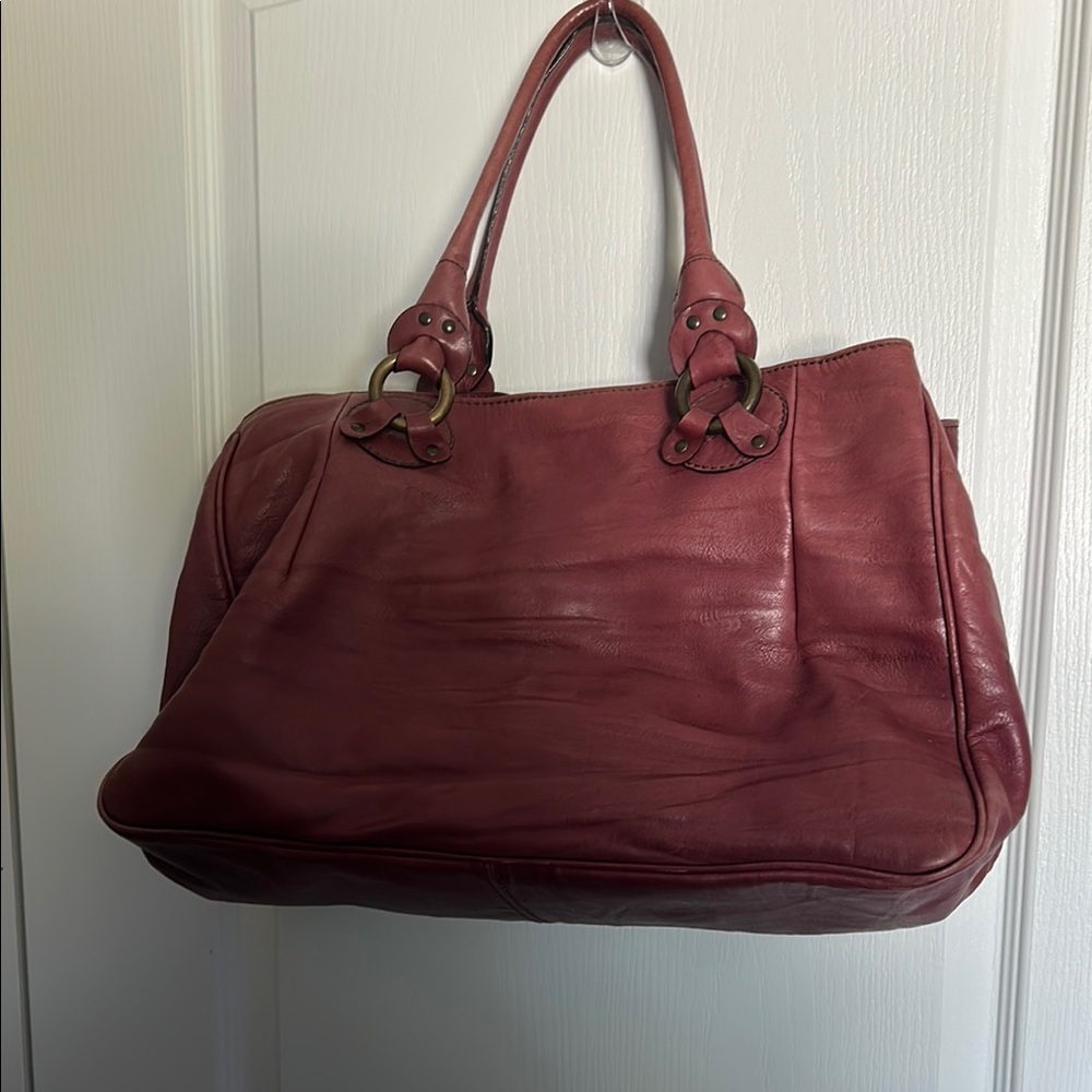 Falorni Italia leather shoulder bag, often described in colors plum or mauve.
